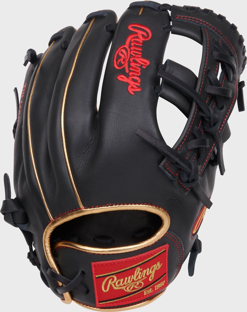 Back of a dark shadow NXT 11.5" Infield glove with a red Rawlings patch loading=