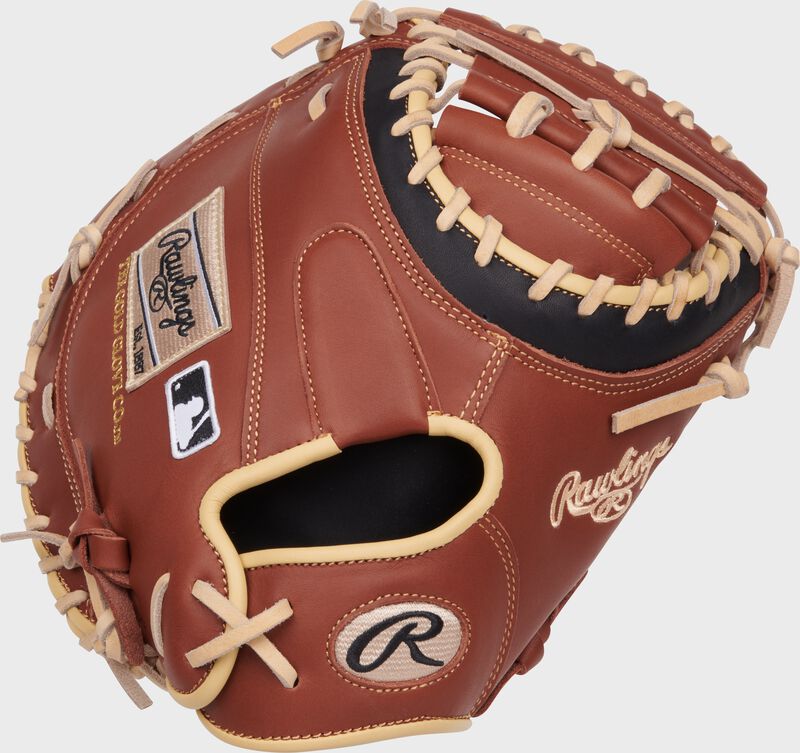 Back of a dark brown NXT Series 32.5" catcher's mitt with a tan Rawlings patch and Oval-R loading=