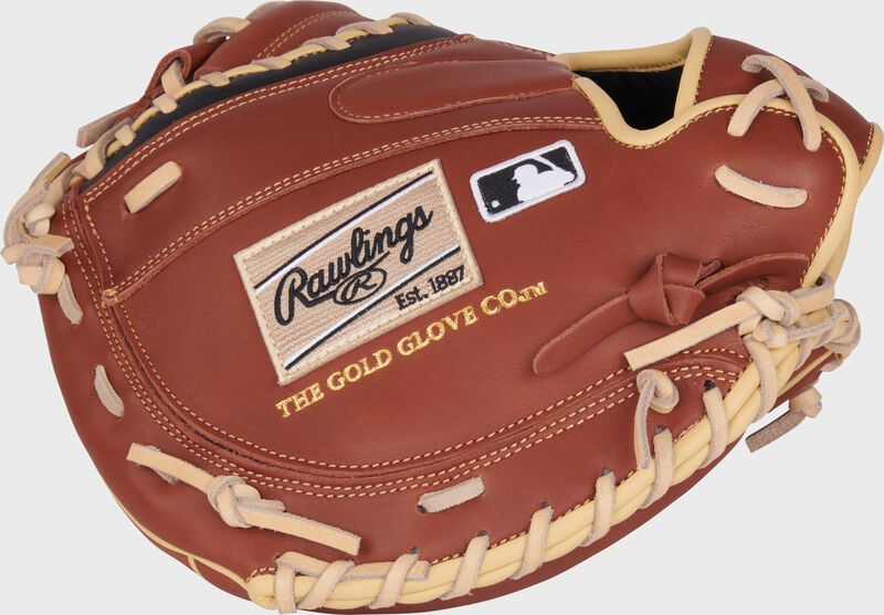 Dark brown back of a NXT Series 32.5" catcher's mitt with a camel Rawlings patch and MLB logo loading=