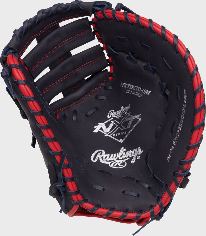Navy palm of a Rawlings NXT Series 1st base mitt with silver stamping and navy laces loading=