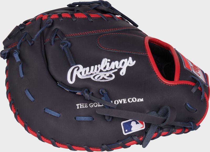Navy back of a NXT Series 12.25" 1st base mitt with the MLB logo on the pinky loading=
