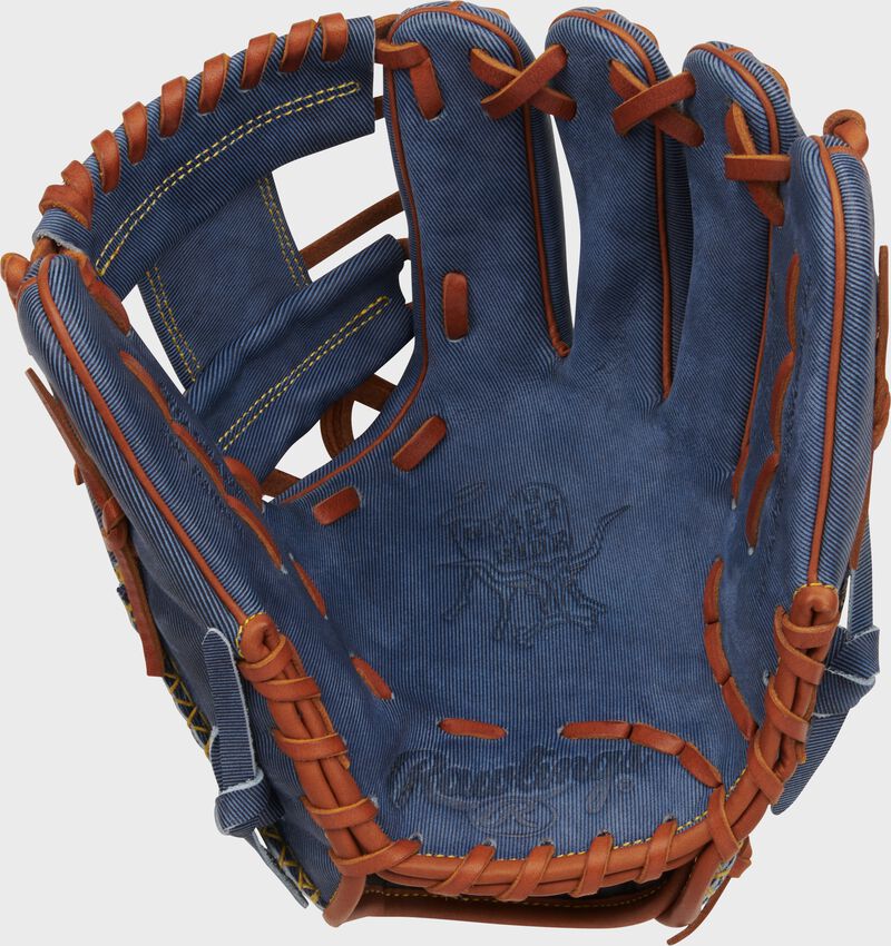 Palm of a Rawlings Heart of the Hide Pro Label Denim infield glove with tan laces loading=