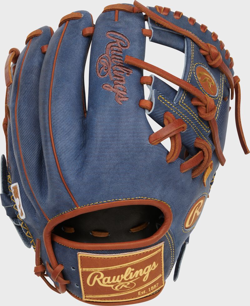 Back of a Heart of the Hide Pro Label Denim infield glove with a tan leather Rawlings patch loading=