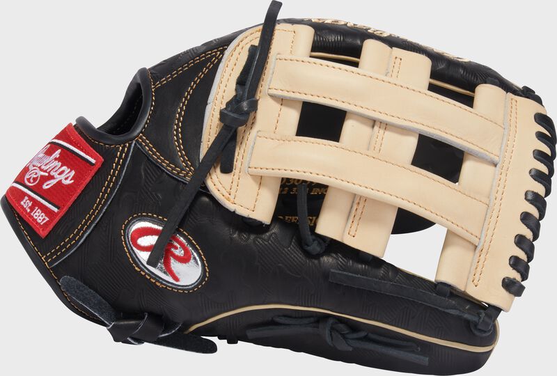 Thumb of a black/camel Gameday 57 Series Fernando Tatís Jr. Heart of the Hide Glove with a platinum Oval-R and camel H-web loading=