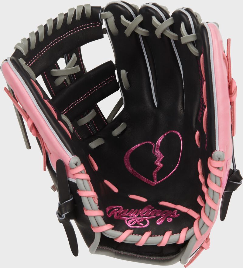 Black palm of a Rawlings Heart of the Hide Broken Heart 11.5" glove with a pink broken heart stamped in the palm loading=