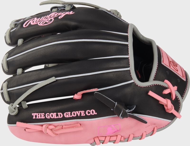 Back of a black/pink Rawlings Heart of the Hide Broken Heart 11.5" glove with the MLB logo on the pinky loading=