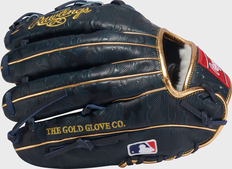 Navy geo-print leather back of a Gameday 57 Series Anthony Volpe Pro Preferred glove with the MLB logo on the pinky loading=