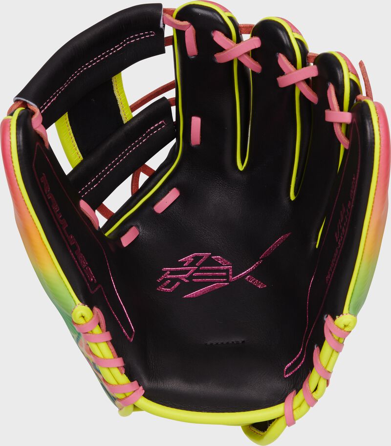 Black palm of a Rawlings exclusive REV1X infield glove with pink stamping and pink laces loading=
