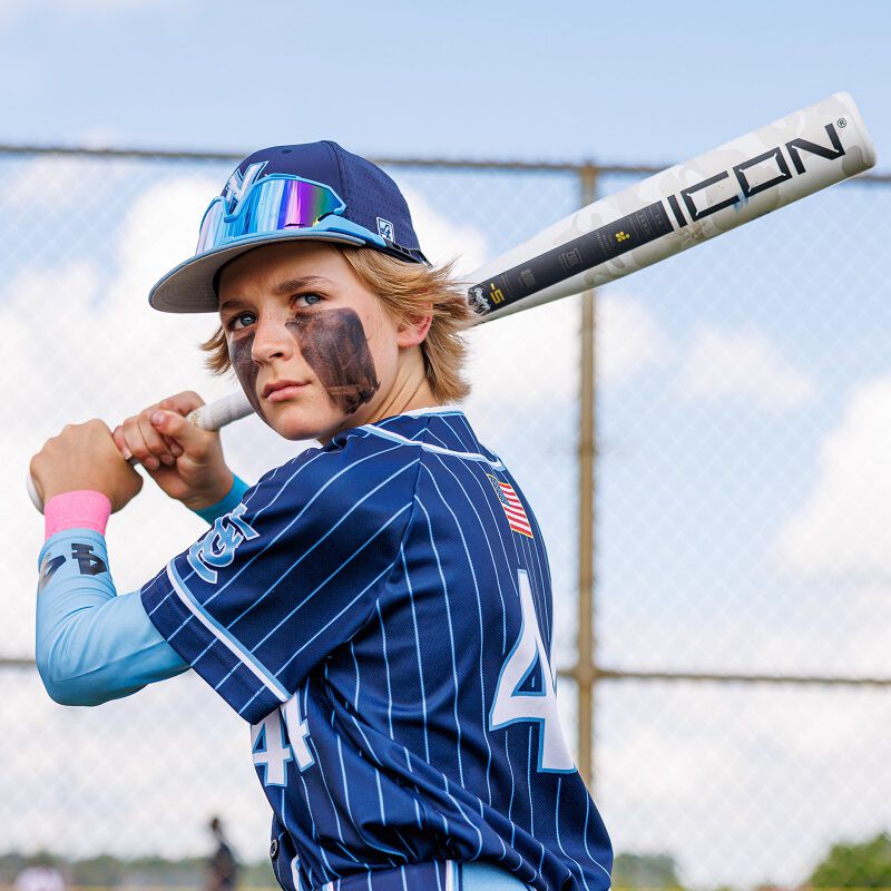 Picture of a player hin his batting stance with a 2025 USSSA Icon bat loading=